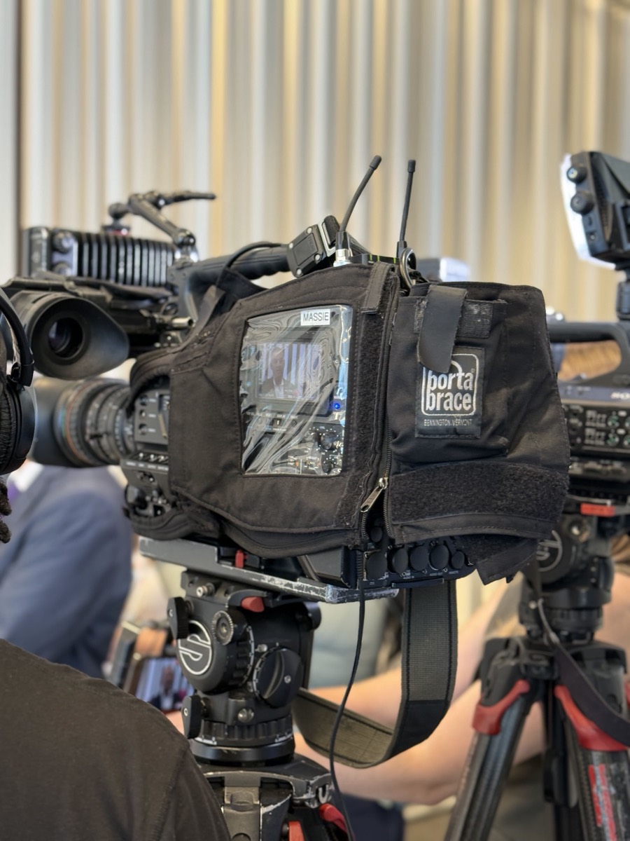 Broadcast cameras lined up in the press area